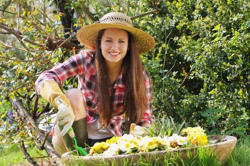 Professional gardener trimming hedges in Abbey Wood